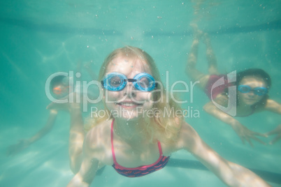 Cute kids posing underwater in pool