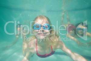 Cute kids posing underwater in pool