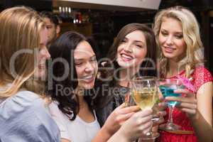 Happy friends having a drink together