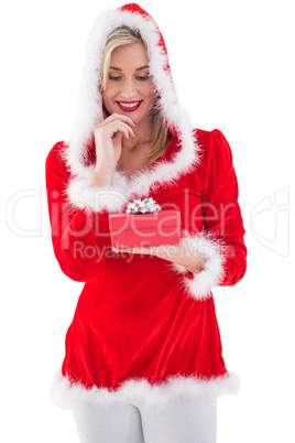 Festive blonde holding a gift