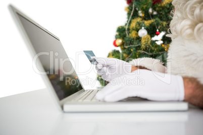 Santa shopping online with laptop Santa shopping online with laptop