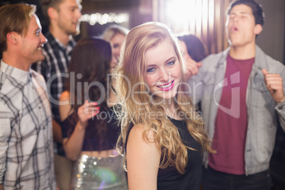 Stylish blonde smiling at camera