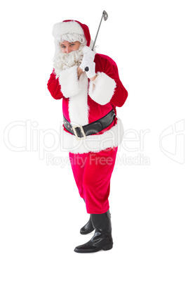 Cheerful santa claus playing golf