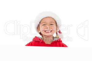 Festive little girl showing poster