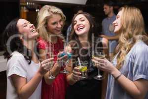 Pretty friends having a drink together