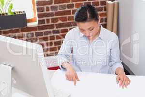 Concentrated woman working at desk