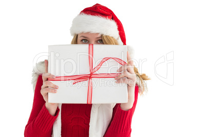 Blonde woman hiding behind a gift