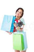 Happy brunette with shopping bags and gifts