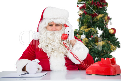 Irritated santa claus on the phone