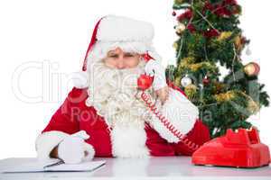 Irritated santa claus on the phone