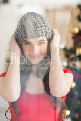 Portrait of a pretty brunette in grey hat