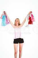 Pretty young blonde holding shopping bags