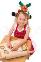 Festive little girl making cookies