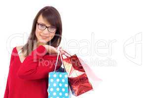 Happy brunette holding shopping bags