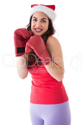 Festive brunette in boxing gloves