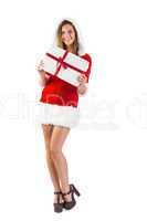 Pretty santa girl standing with gift