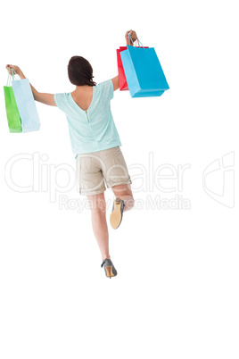 Happy brunette with shopping bags