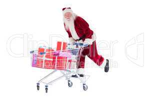Santa rides on a shopping cart