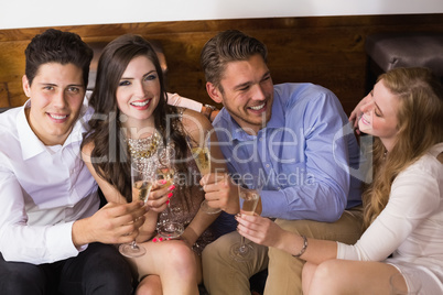 Stylish friends having a drink together