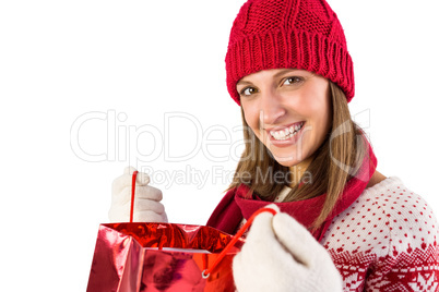 Festive blonde opening a gift bag