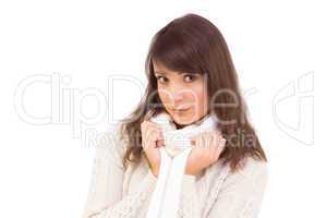 Brunette in winter clothes smiling at camera