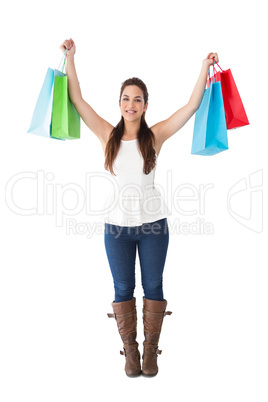 Brunette in casual clothes holding shopping bags