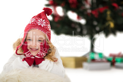 Festive little girl in hat and scarf