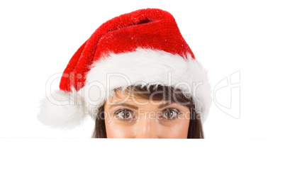 Close up portrait of pretty woman in santa hat