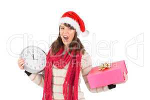 Yelling brunette holding a clock and gift