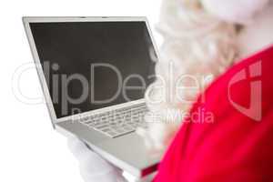Father christmas using his laptop