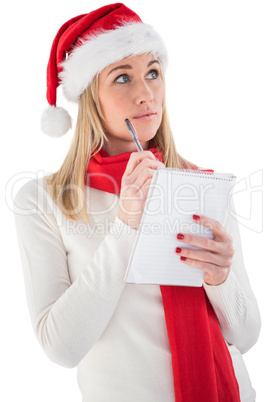 Festive blonde writing her christmas list