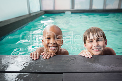 Little boys smiling in the pool