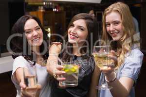 Pretty friends having a drink together