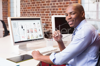 Businessman with computer at office desk