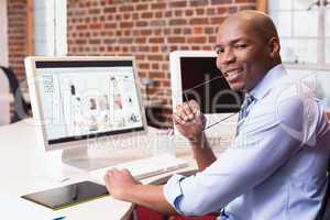 Businessman with computer at office desk