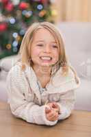 Festive little girl smiling at coffee table