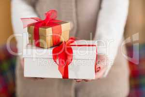 Woman with nail varnish holding gifts