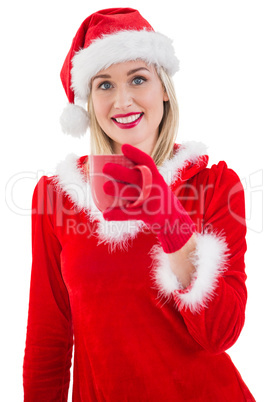 Festive blonde holding a mug