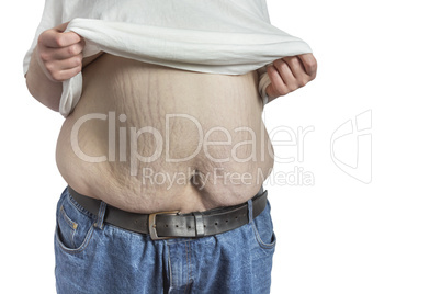 overweight Man in blue jeans lifting white shirt