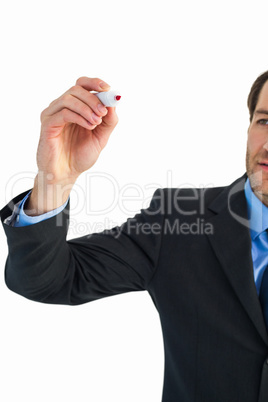 Businessman writing with red marker