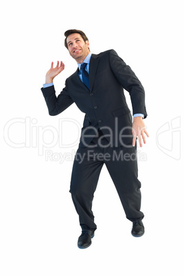 Businessman carrying something heavy with his hands