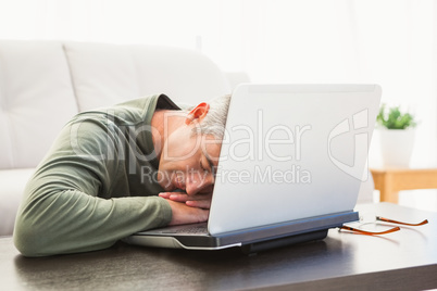 Man sleeping on his laptop