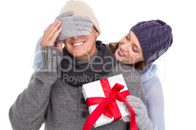 Woman surprising husband with gift