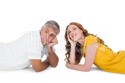 Casual couple lying on floor