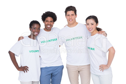 Young smiling volunteers looking at camera