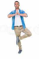 Man with grey hair in tree pose