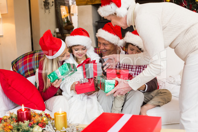 Grandmother giving gift to her family