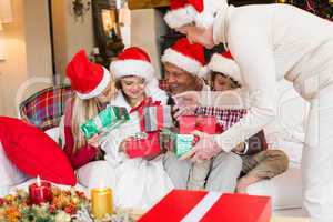 Grandmother giving gift to her family