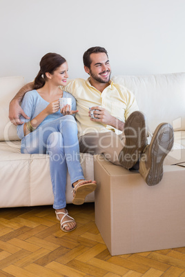 Young couple taking a break from unpacking