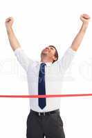 Businessman celebrating success with arms up